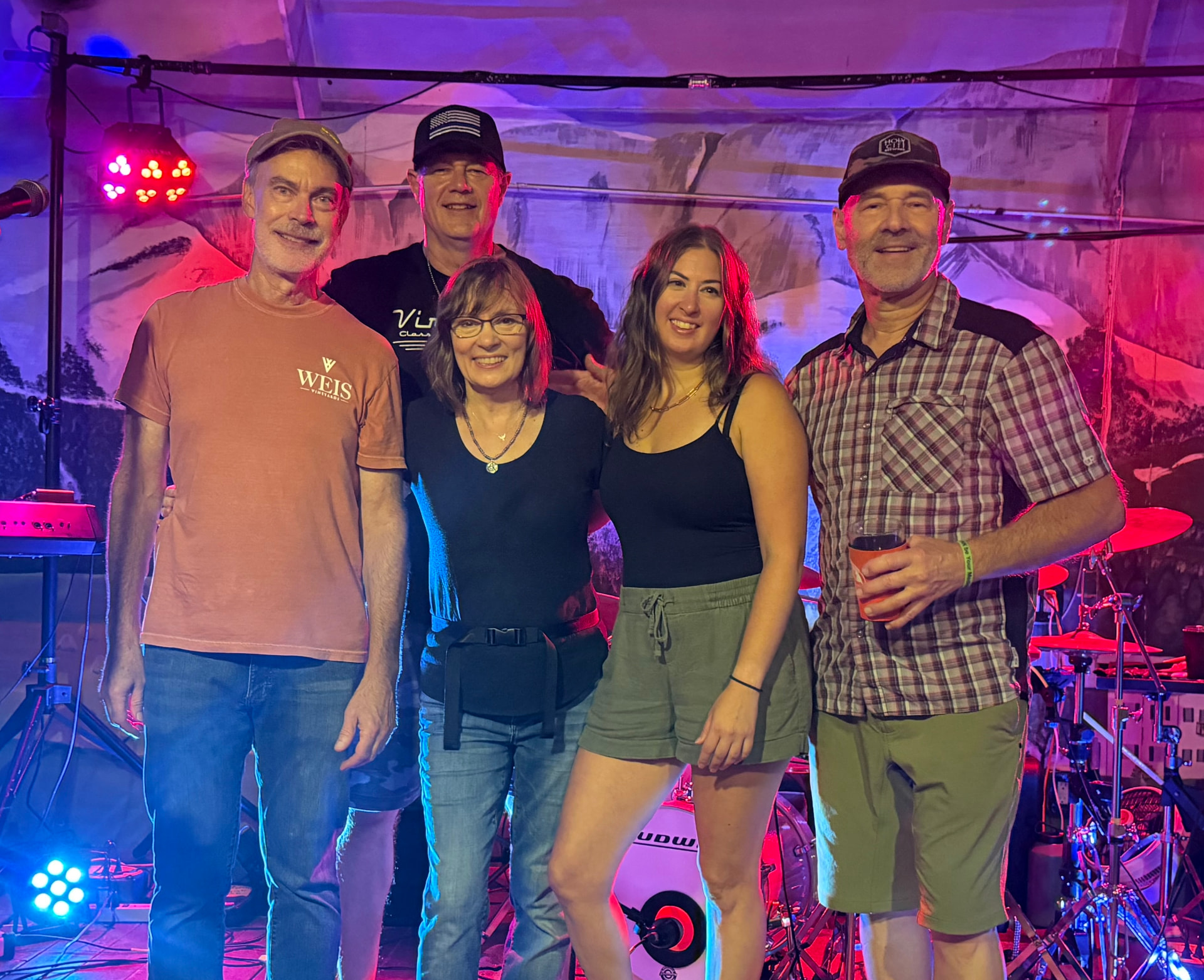 Reality Chick band members smiling together on stage